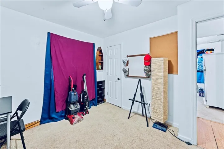 Misc room with carpet flooring and ceiling fan