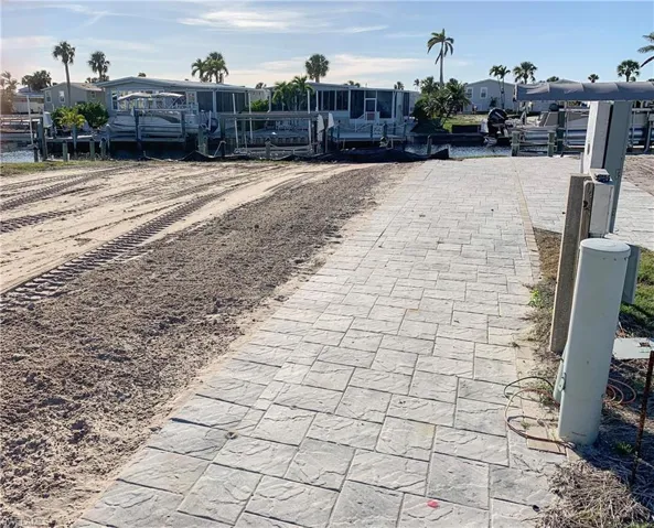 Front lot with pavers lining the lot line