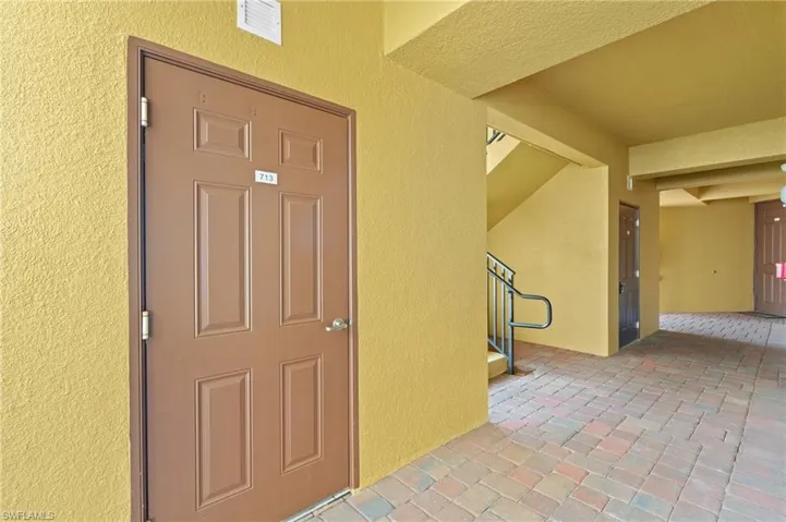 Doorway to property with visible vents