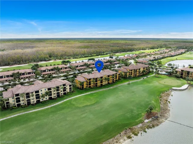 Bird's eye view with a water view and golf course view