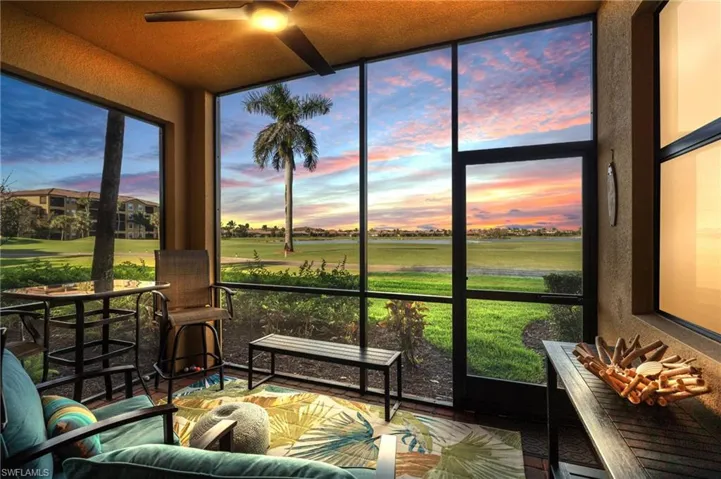 Sunroom featuring a ceiling fan