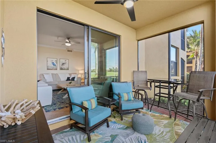 Sunroom / solarium with visible vents and ceiling fan