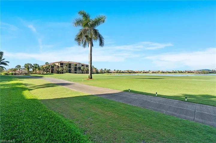 View of property's community featuring a yard
