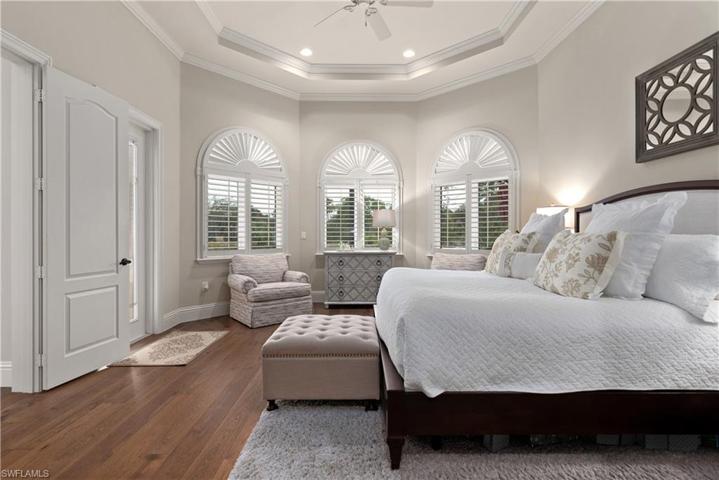 Wood flooring, detailed ceilings, french doors with lots of light and Plantation Shutters