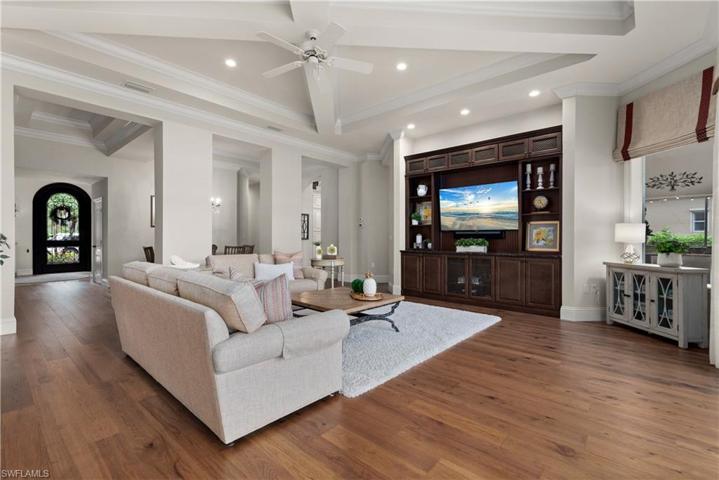 Detailed ceilings, built-in cabinets, wood flooring with lots of light.