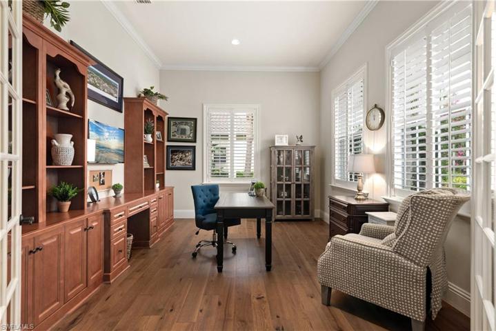 Wood flooring, crown molding, built-in cabinets with lots of light and Plantation Shutters