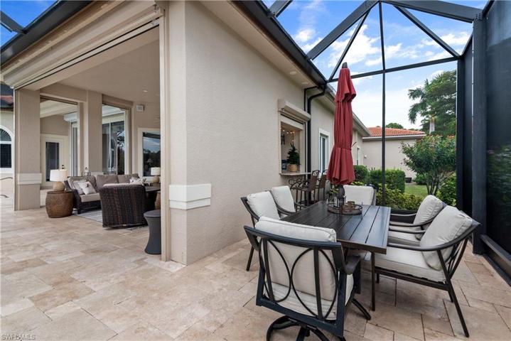 Additional lanai area to enjoy outdoor dining with a pass through window from summer kitchen