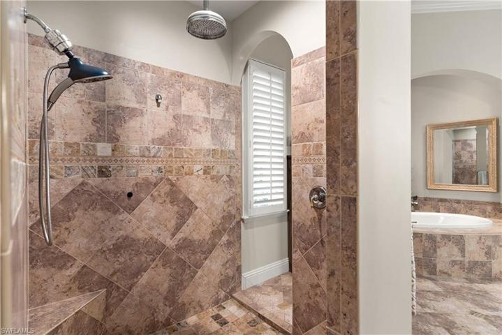 Walkthrough Shower with Rain Shower Head, full decorative tiling and Plantation Shutter
