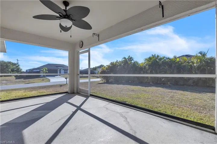 Unfurnished sunroom with a ceiling fan