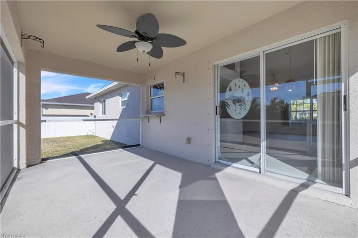 View of patio featuring a ceiling fan