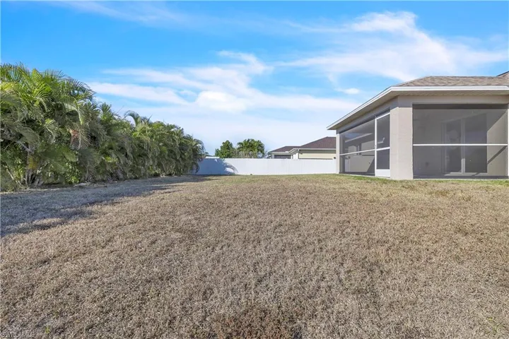 View of yard with a sunroom