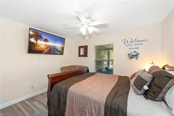 Bedroom with wood finished floors and a ceiling fan