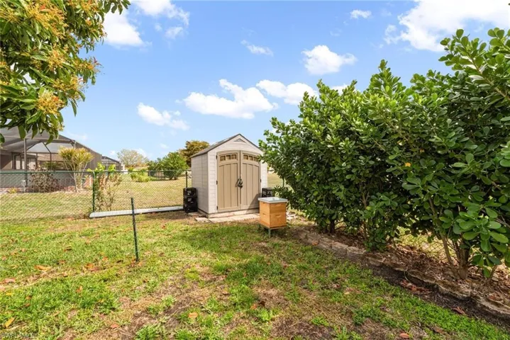 View of yard with a storage shed