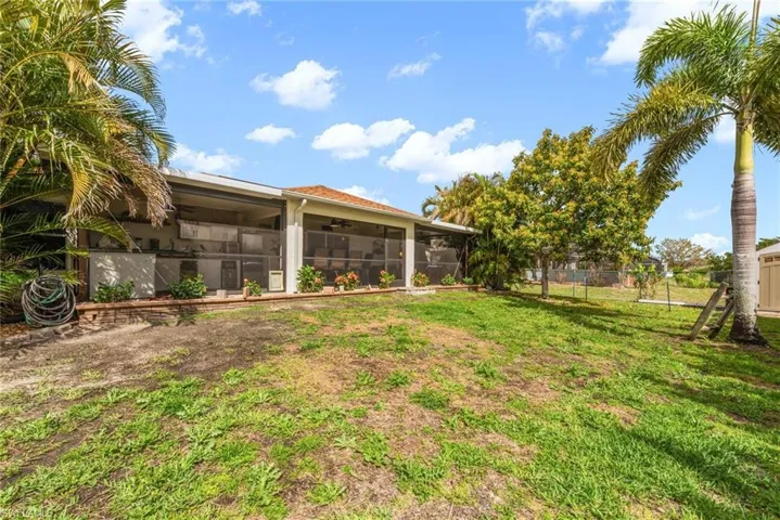 View of yard featuring a sunroom