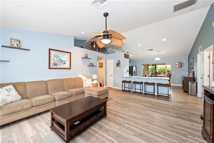 Single story home featuring an attached garage, stucco siding, and driveway