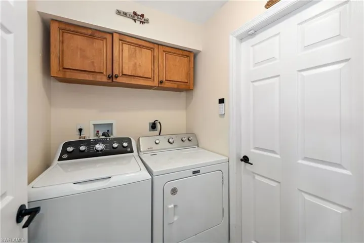 Laundry room with cabinet space and washing machine and dryer