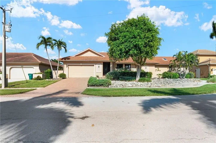 Ranch-style home featuring a garage