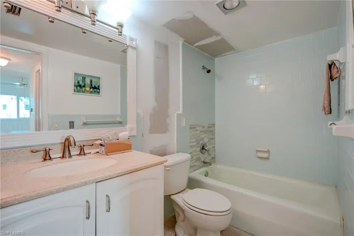 Full bathroom featuring vanity and shower / washtub combination