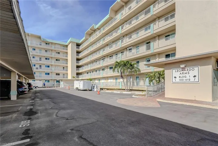 View of apartment building / complex with a parking lot