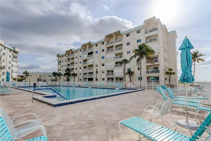 Community pool with a patio area