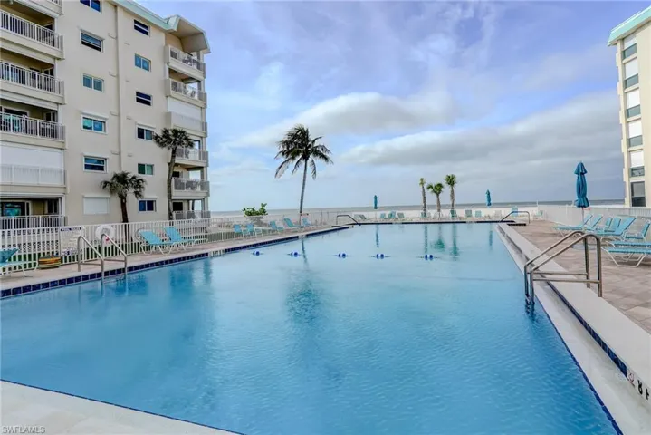 Community pool with a patio area