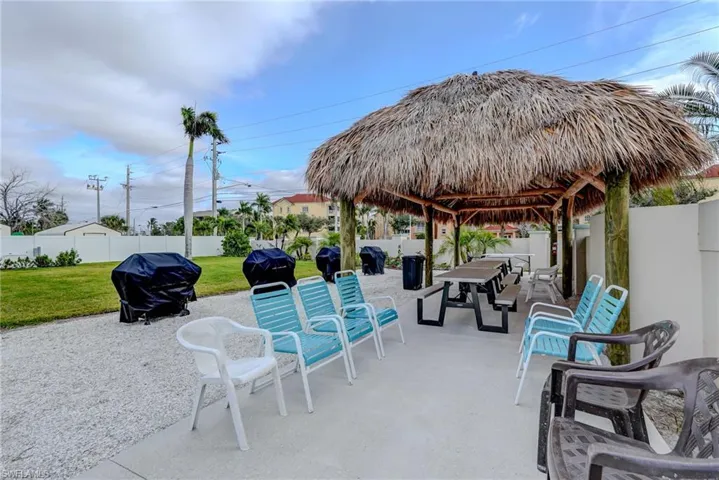 Fenced backyard with a patio, a grill, and outdoor dining area