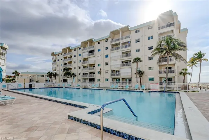 Community pool featuring a patio