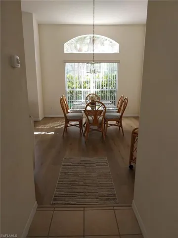 Dining room featuring a chandelier and light wood finished floors