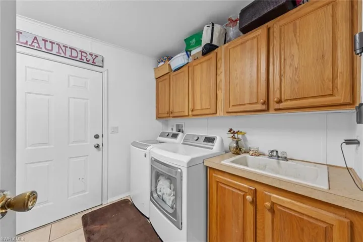 Spacious Laundry room with cabinets!