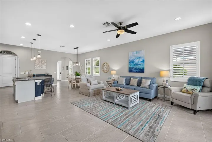 Large, open living area with access to large kitchen and dining area