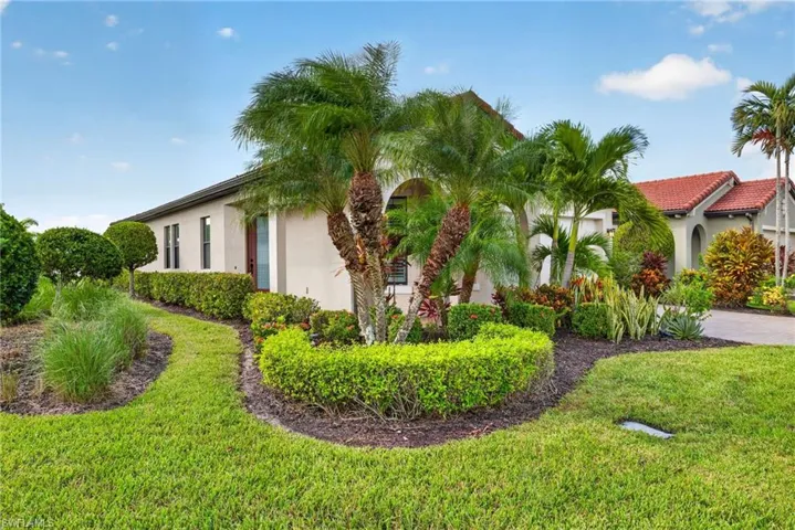 Front of home with large landscaped corner lot