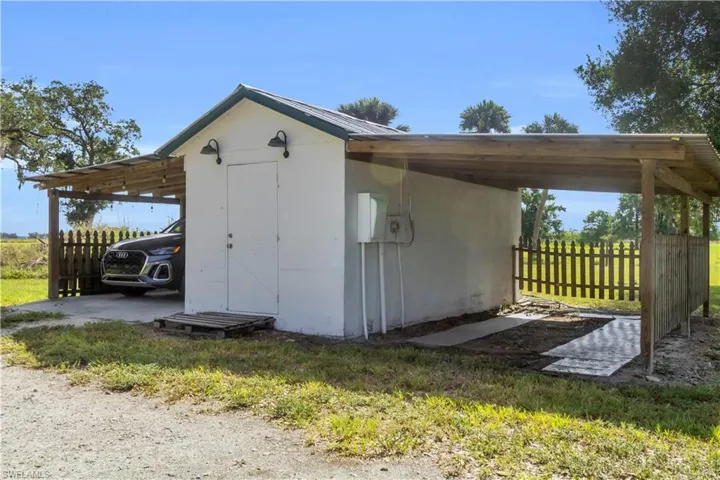 View of shed / structure with a carport