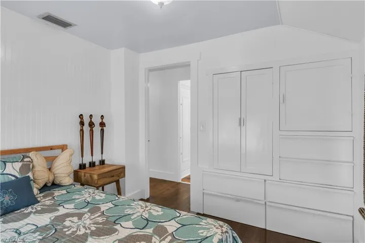 Guest Bedroom with maple wood flooring