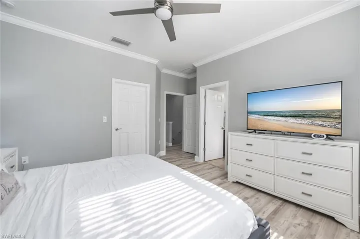 Primary Bedroom with  Crown Molding & Ceiling Fan