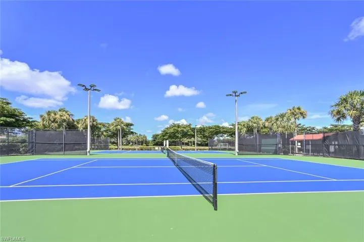 View of tennis court with community basketball court