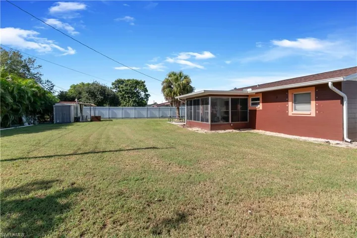 View of yard featuring a sunroom