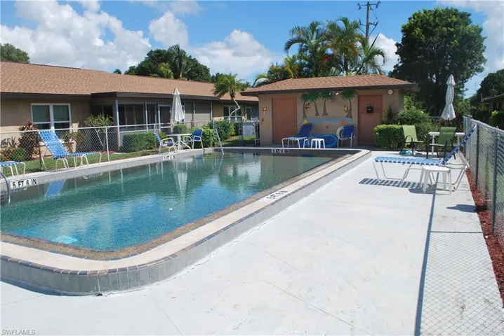 Community pool with a patio