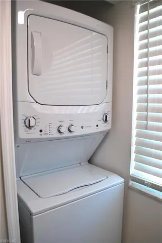 Washroom featuring estacked washer and dryer