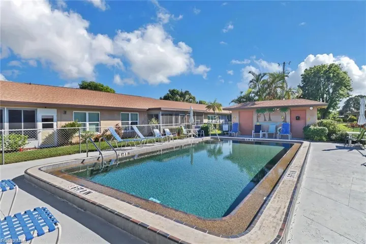 Community pool with a patio area