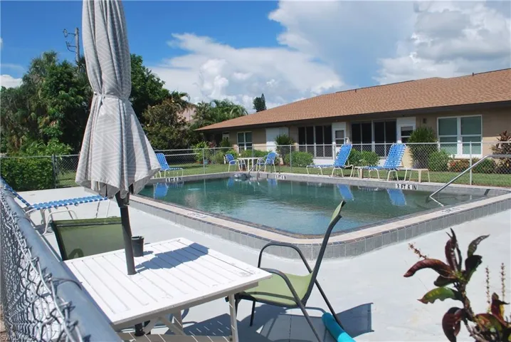 Community pool with a patio area