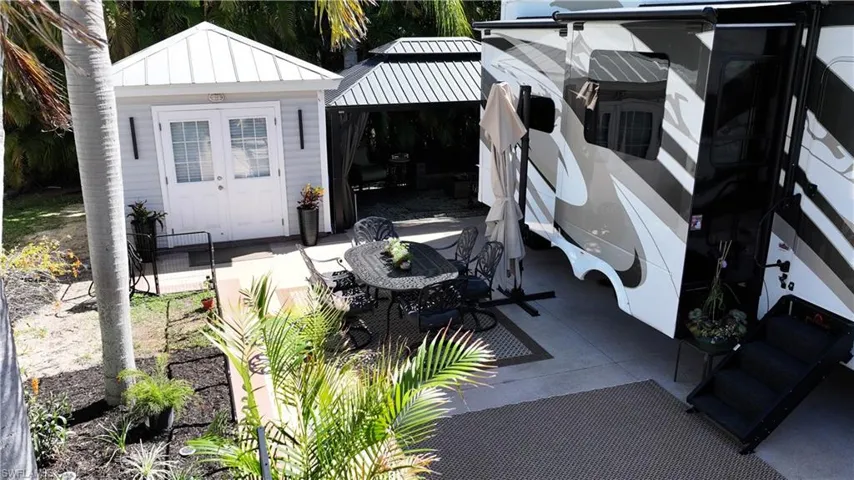 View of patio / terrace with a gazebo and outdoor dining space