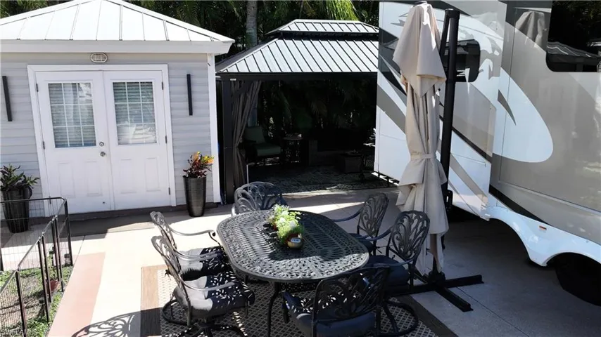 View of patio / terrace featuring a gazebo and outdoor dining area