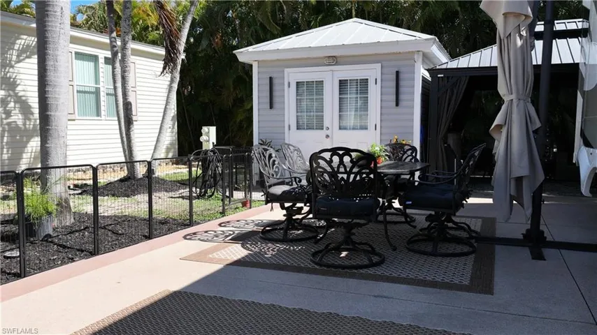 View of patio / terrace with outdoor dining area and an outdoor structure