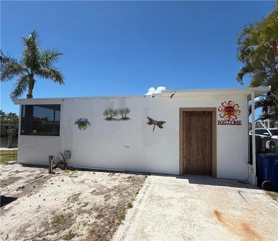 View of pre-existing enclosed lanai with pool and large entertaining area.