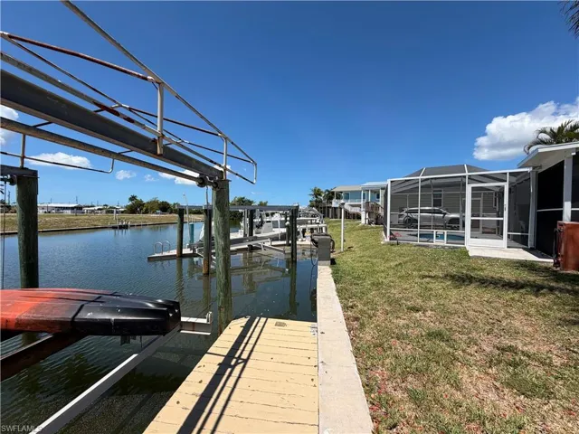 The property features waterfront access with two boat lifts.