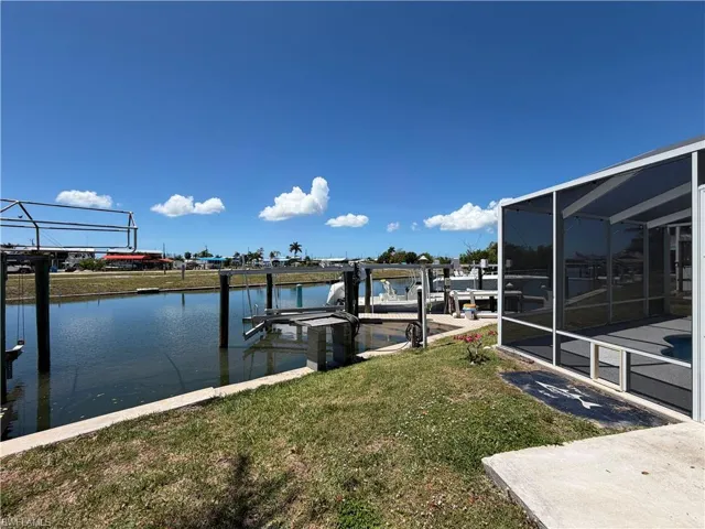 The property features a peaceful canal-front setting where you can fish right from your own dock