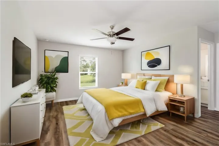 Bedroom featuring dark hardwood / wood-style floors and ceiling fan