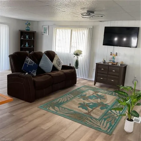 Living room with light hardwood / wood-style floors