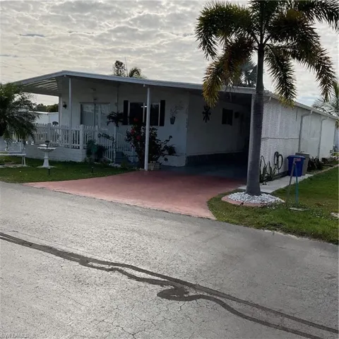 View of front of property featuring a carport