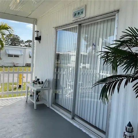 Property entrance with a porch